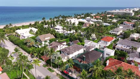 upscale oceanfront neighborhood in palm beach, florida, with mediterranean-style homes and palm-lined streets