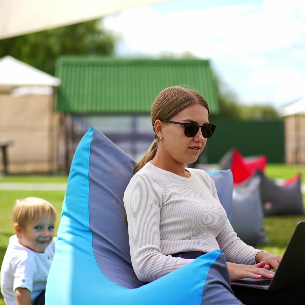 Mom with son playing outdoor. Happy active family outside