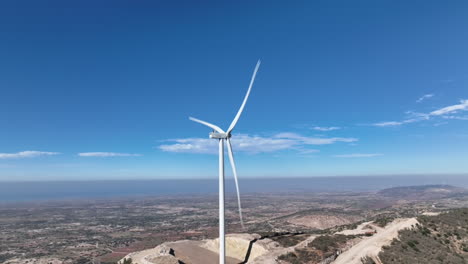 aerial drone footage capturing the wind turbine in action, converting wind into clean energy