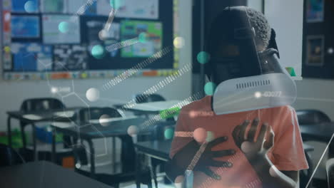 Animation of dna strand, numbers and network of connections over schoolboy using vr headset
