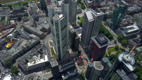 AERIAL:-Breathtaking-rising-View-of-Frankfurt-am-Main,-Germany-Skyline,-Sunny-with-Overcast