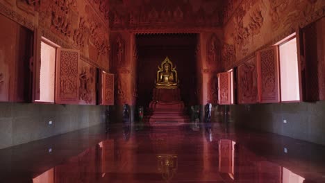 Inside-a-red-Buddhist-temple-located-in-Koh-Samui,-Thailand