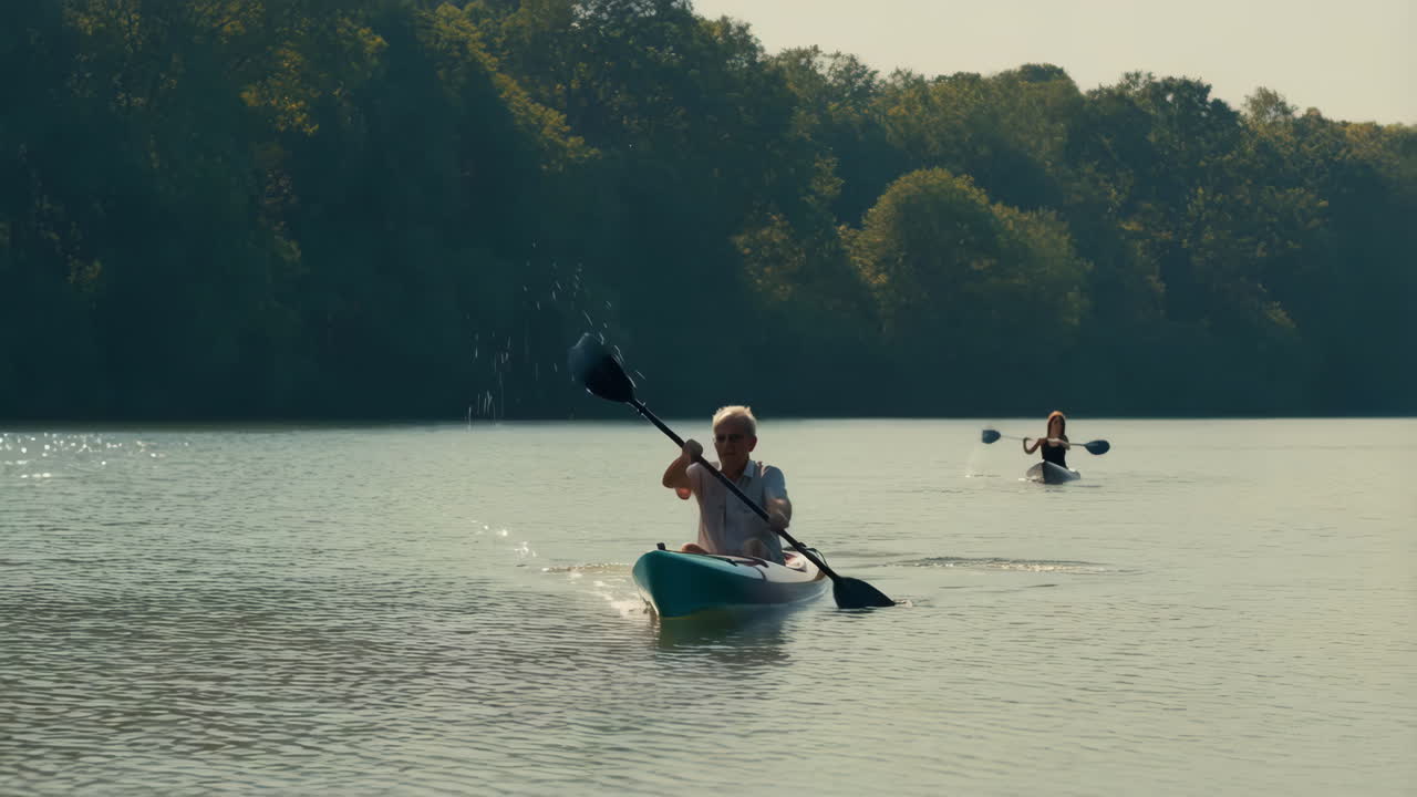 Two people kayaking on a calm river or lake