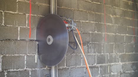 Cutting-concrete-bricks-with-big-circular-saw-vertically-up