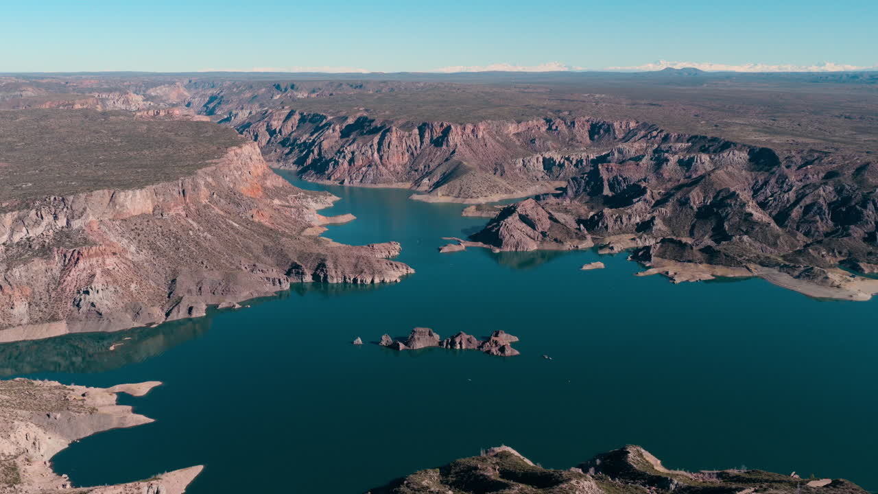 Aerial view of Atuel Canyon with cloudy sky reflection on the water, San Rafael, Mendoza, Argentina.