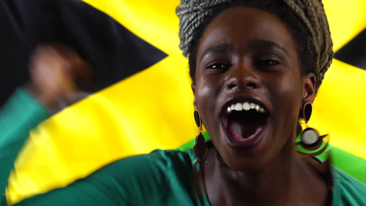 Jamaican Young Black Woman Celebrating with Jamaica Flag
