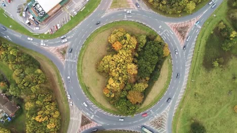 aerial view rotation over roundabout congestion traffic vehicles from above