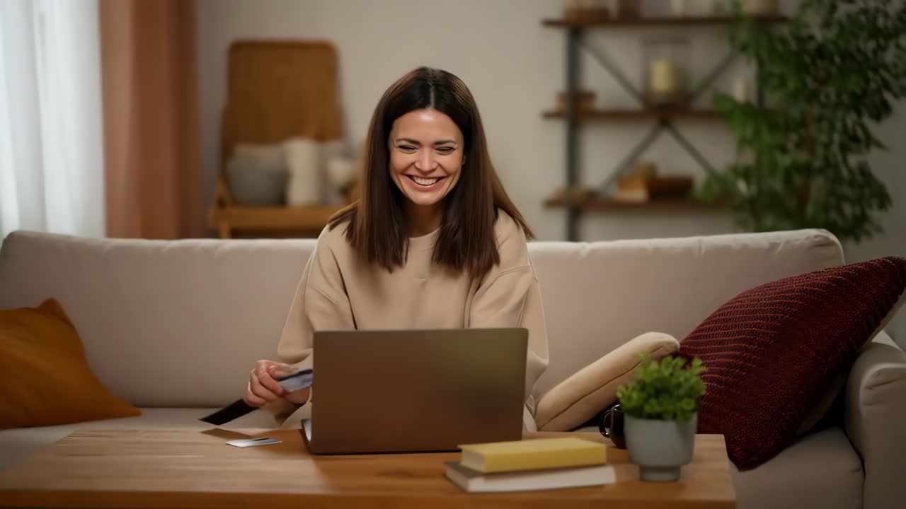 Woman using laptop for online shopping at home