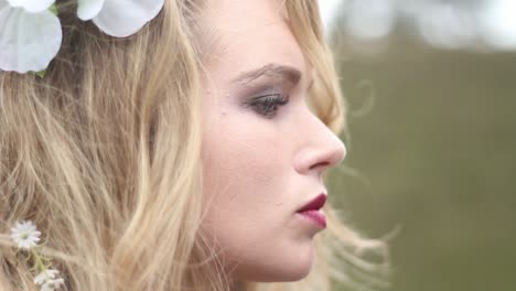 Beautiful-young-woman-with-flowers-in-her-hair