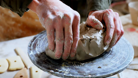 male potter moulding a clay 4k