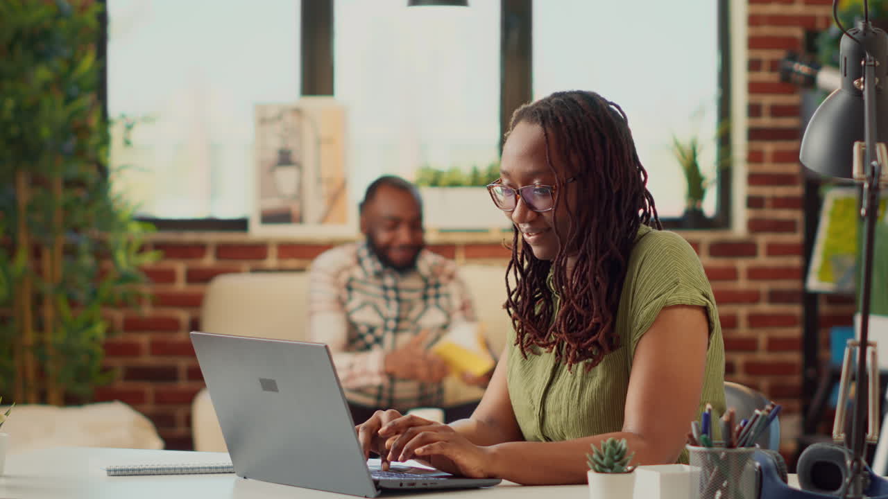 Office worker analyzing business report on laptop