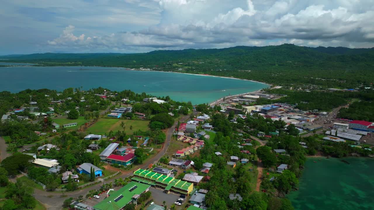 Wewak Hill Seawall Dogreto Bay Boram road coastal town Meni Beach aerial drone Wewak capital East Sepik Region Province Papua New Guinea PNG summer sunny morning clouds dry season forward down motion