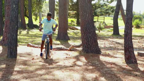 man with headphones riding bicycle in the park 4k