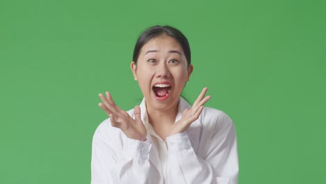 excited asian woman in white lab coat