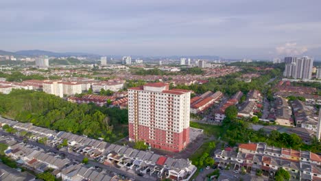 Aerial-circling-over-abandoned-building-in-Cheras-district,-Kuala-Lumpur