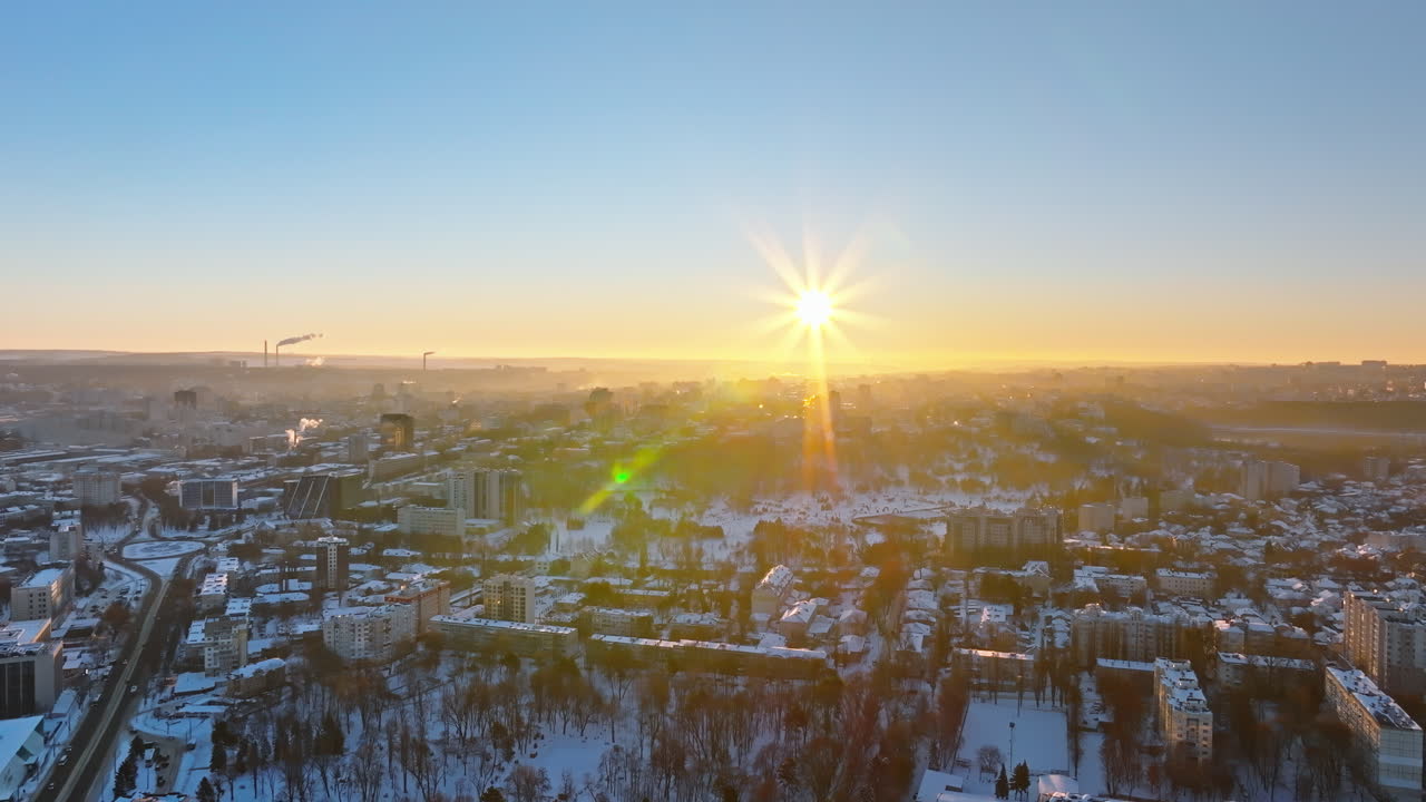 Aerial drone view of the city covered in snow. Sunrise during winter in Chisinau, Moldova