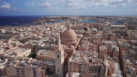 smooth aerial orbit around st paul's cathedral dome in valletta, malta