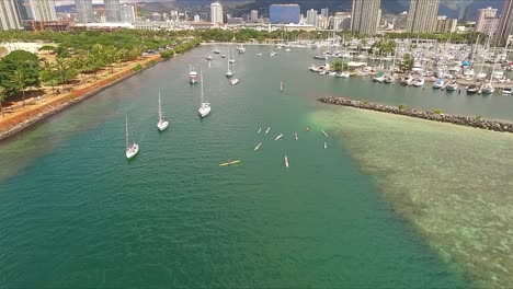 Parade-of-boats-departing-Ala-Wai-boat-harbor-in-Oahu-on-a-sunny-day