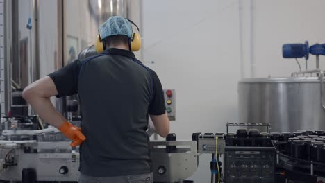 worker in a beverage canning factory