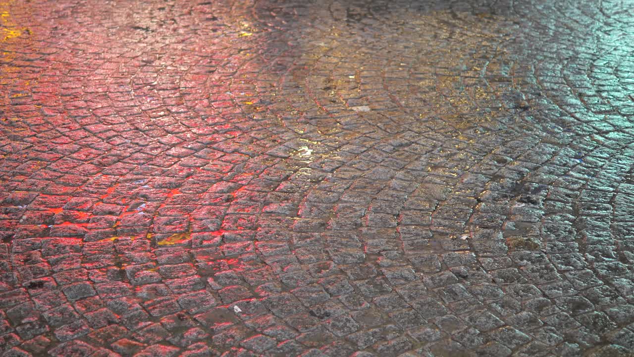 Wet Cobblestone Street at Night