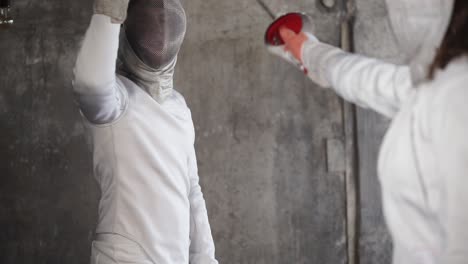 two fencers in action