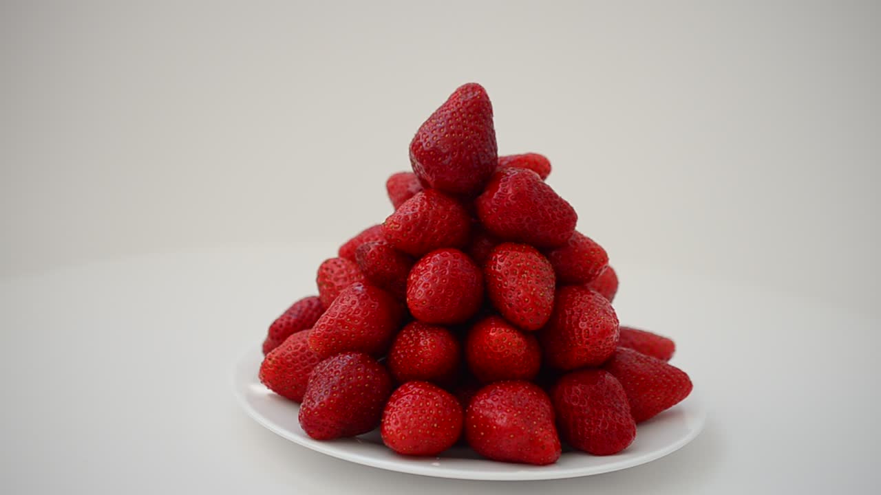 Strawberry on a white background, isolate. Shooting in the movement