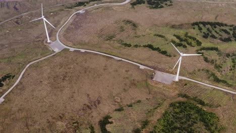 Drone-shot-of-a-wind-farm-working-on-the-Isle-of-Lewis-on-a-cloudy-day