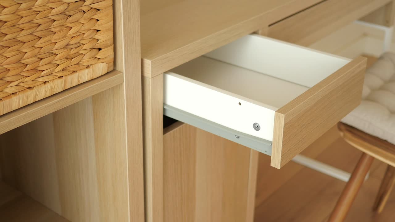 Open Drawer of Light Brown Wooden Desk
