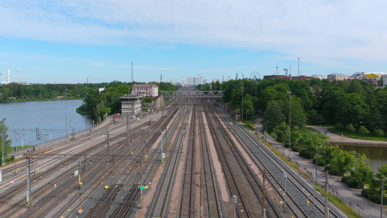 Drone flying low over the empty main railway, sunny, summer day in Helsinki