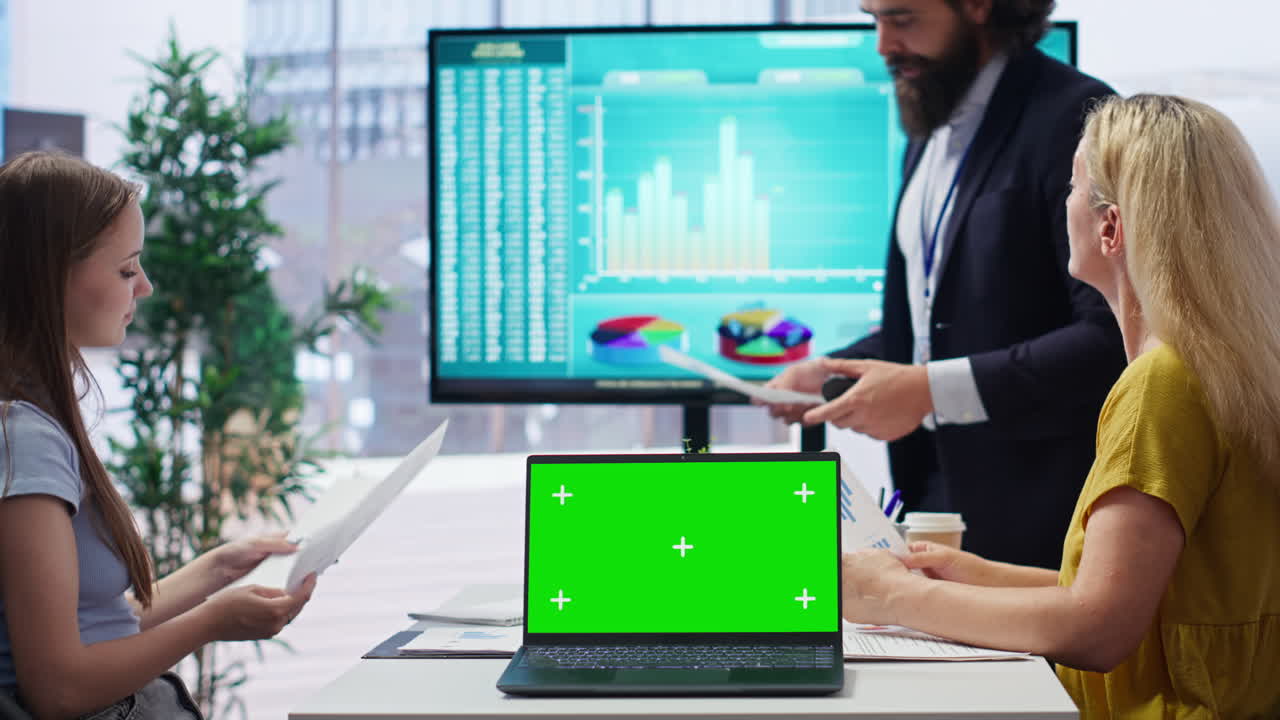 Agent using chroma key notebook to show customers investing tips