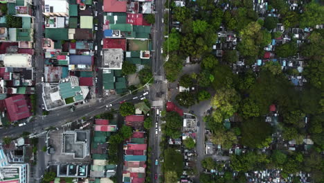 top down drone shot above traffic on the south ave street, in makati, philippines