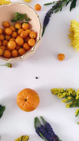 fresh fruit and flower arrangement