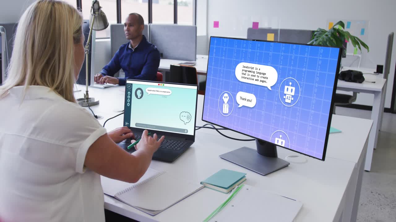Caucasian businesswoman using laptop and computer with digital chat and icons in office