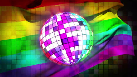 bola de discoteca girando con la bandera del orgullo gay