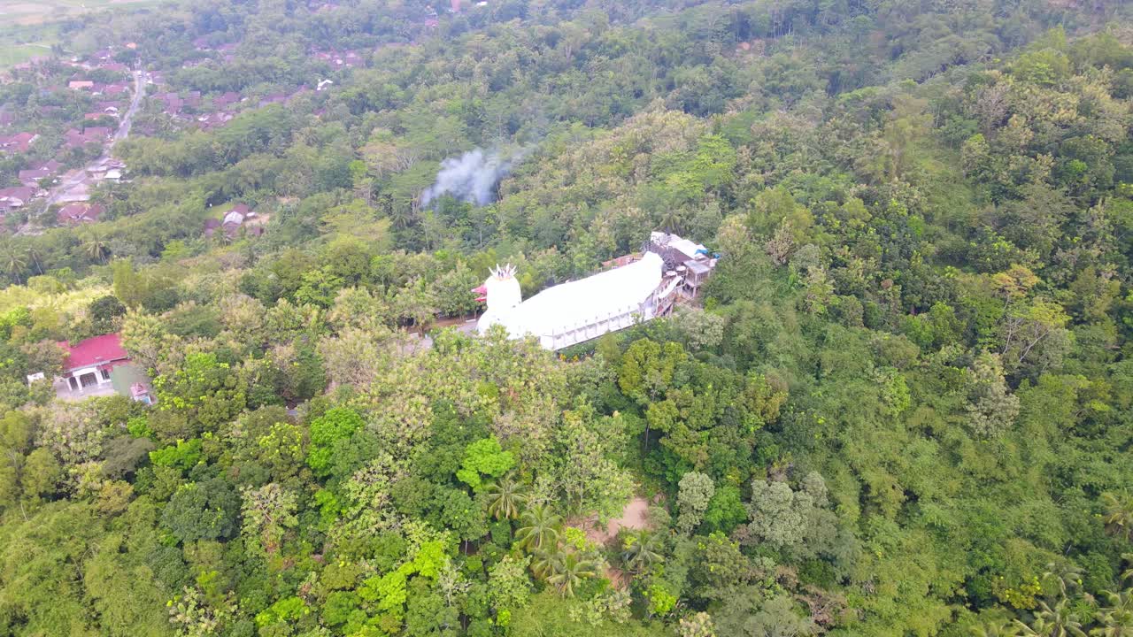 High altitude drone shot of Chicken Church &amp;quot;Gereja Ayam&amp;quot; on Rhema Hill
