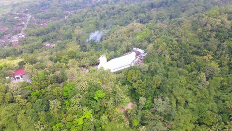 High-altitude-drone-shot-of-Chicken-Church-"Gereja-Ayam"-on-Rhema-Hill