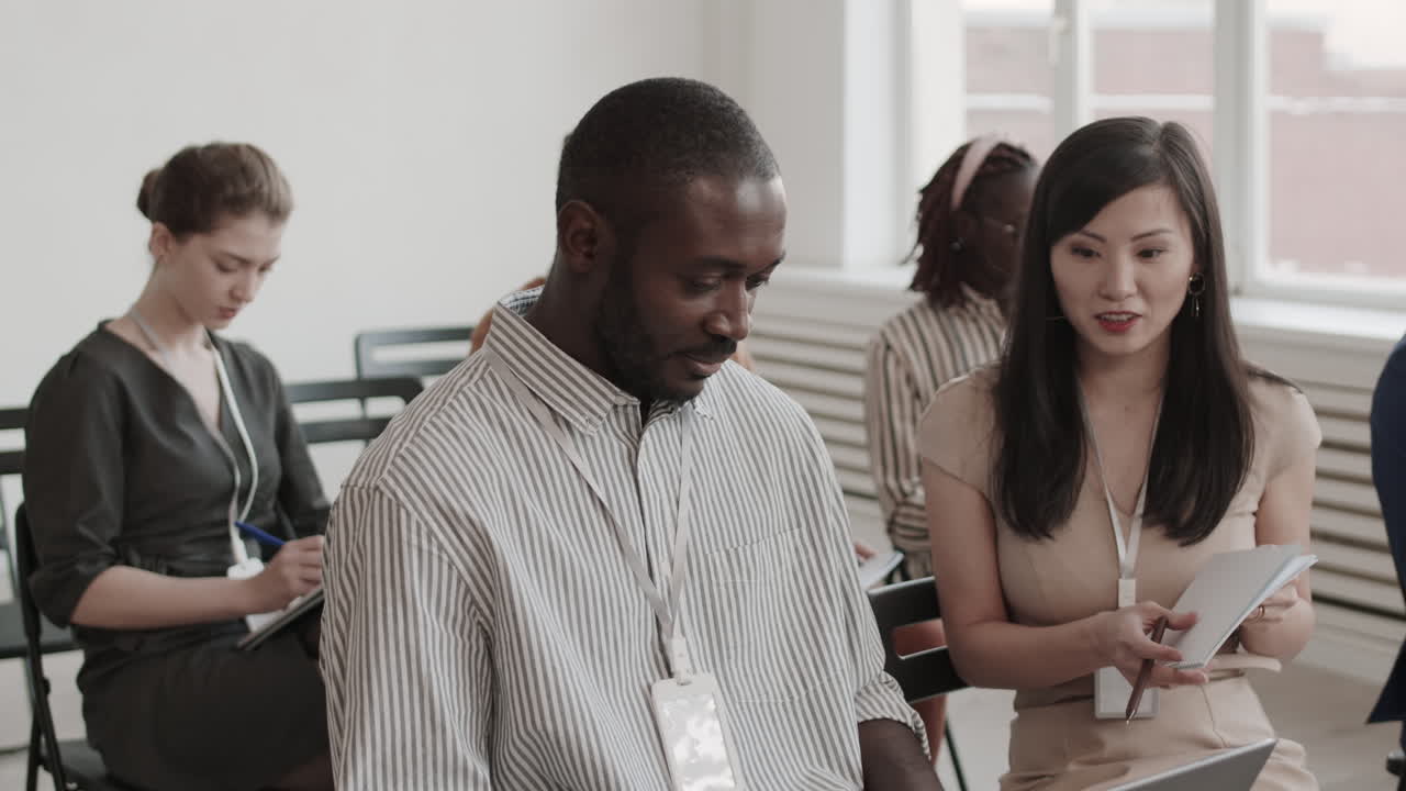 Colleagues Talking in Conference Room
