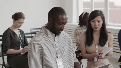 colleagues talking in conference room