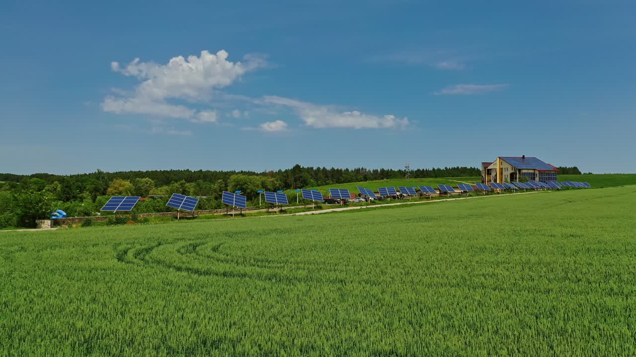 Solar cells on green field. Beautiful landscape of nature and photovoltaic solar panels on field generate clean energy at sunlight. Renewable energy.