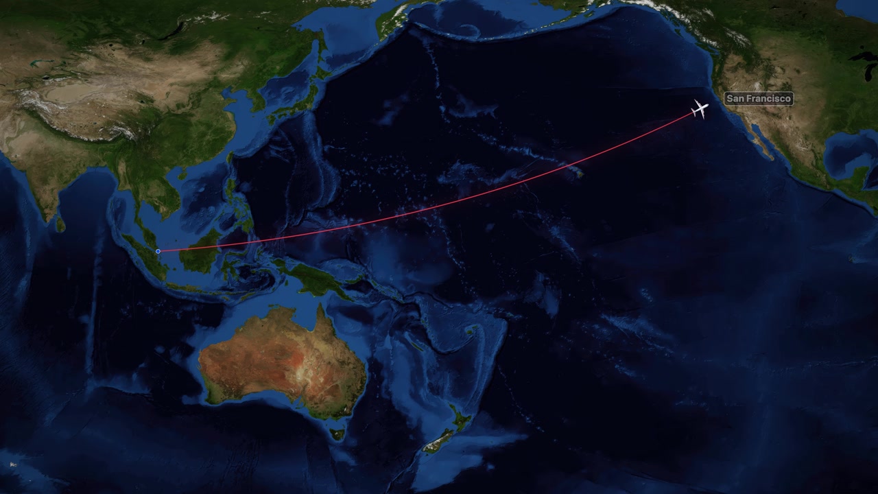 Red line traces an airplane flight path from Singapore to San Francisco over satellite imagery
