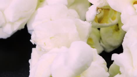 close up view of popcorn rotating, 4k macro shot