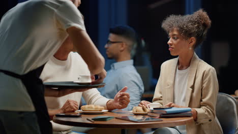 female and male business partners working together indoors