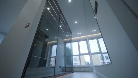 sleek modern wardrobe hallway with reflective black doors