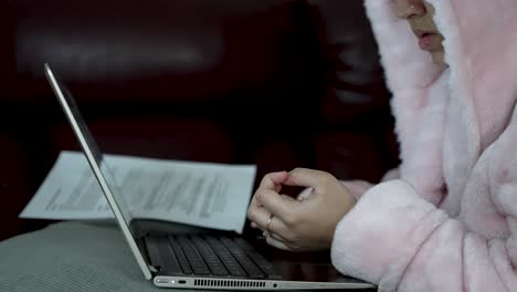 a person is sitting in front of the laptop and slowly moving fingers along the touchpad, concept utilization of digital tools to study and learn