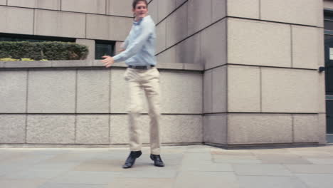 Contemporary-funky-caucasian-businessman-street-dancer-dancing-freestyle-in-the-city