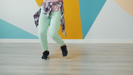 woman dancing in a colorful room