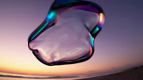 iridescent bubble reflected over a sunset beach