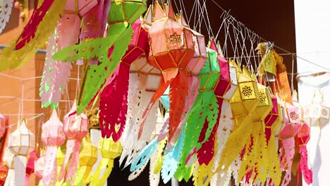 vibrant lanterns moving in a breeze outdoors