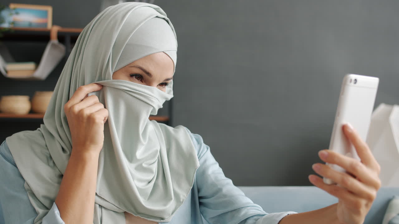Woman in Hijab Taking a Selfie