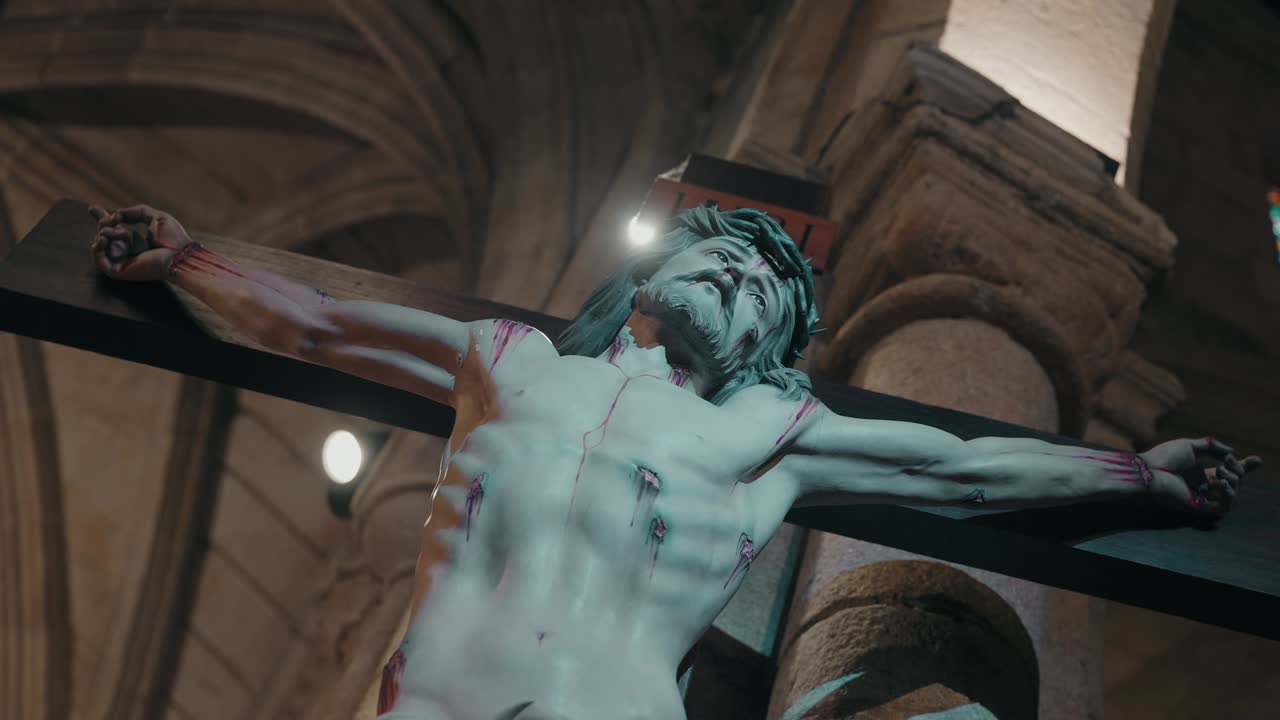 realistic crucifix statue of jesus displayed in ancient cathedral interior
